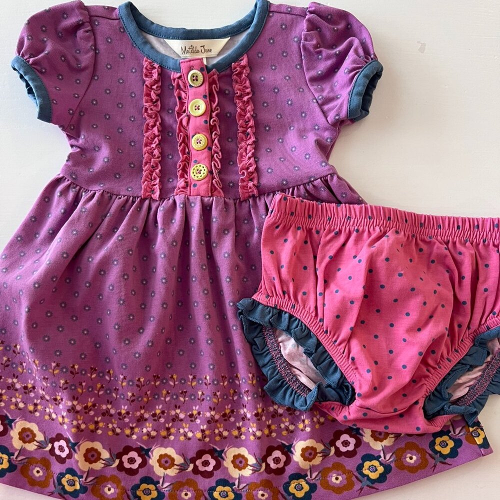 This precious set features a teal long‑sleeve dress with large white polka dots,